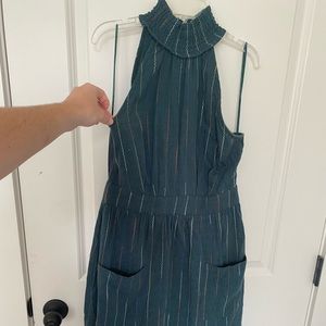 Boutique midi dress with two pockets in front. Zipper closure. Size M